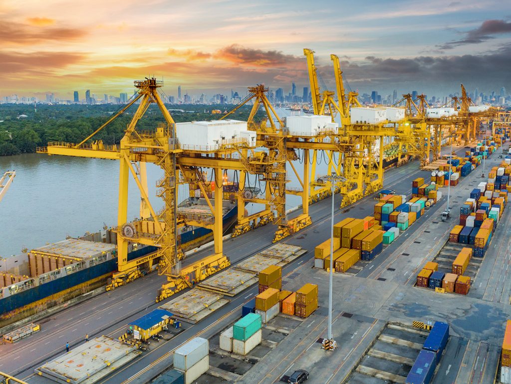 new york port with cranes unloading seacans