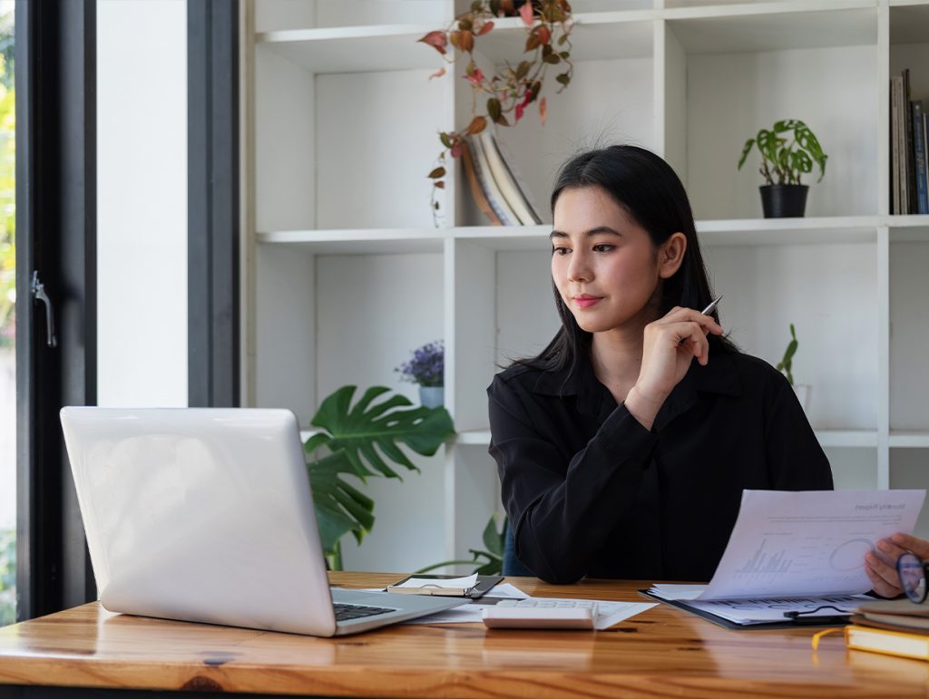 Advisor on her computer reviewing their accounts