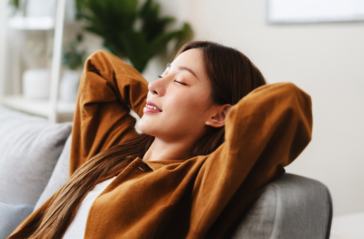 Young professional woman relaxing on the couch content