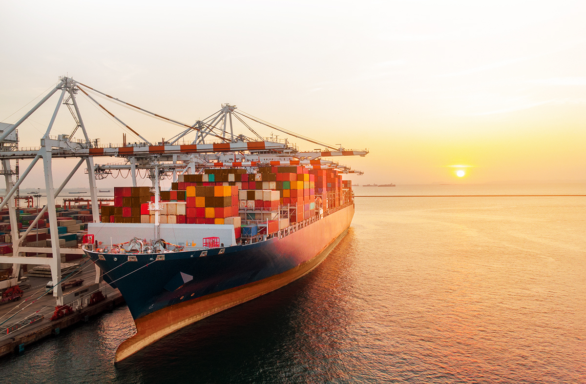 Shipping container boat arriving at a port