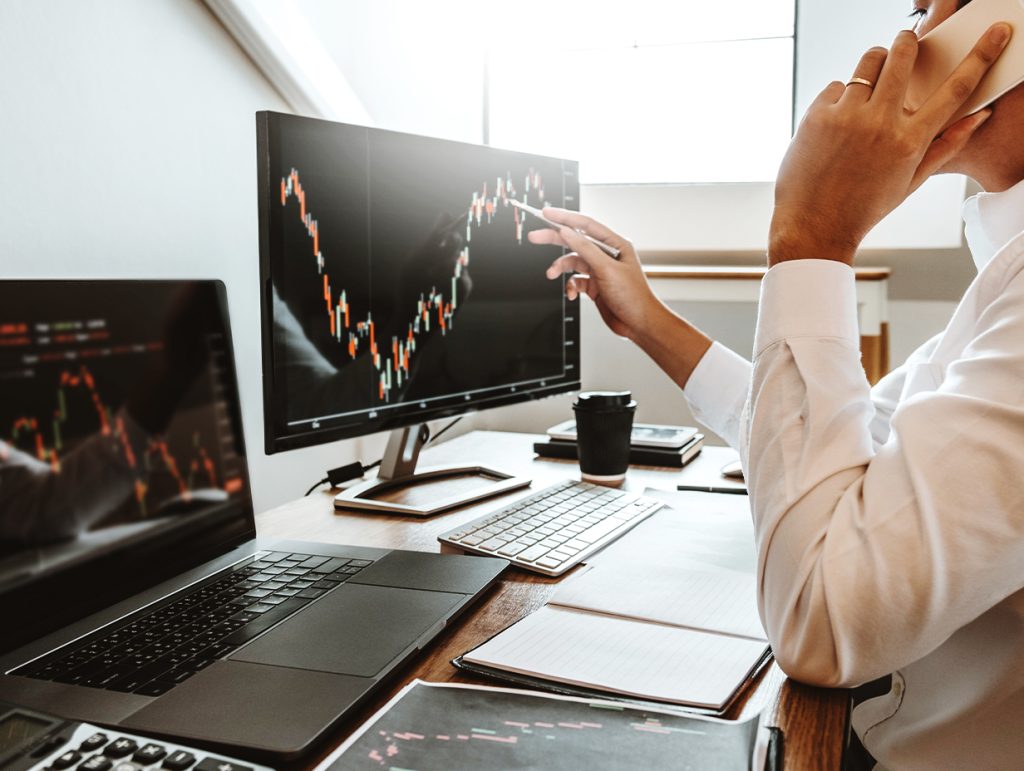 financial analyst reviewing market data in his office