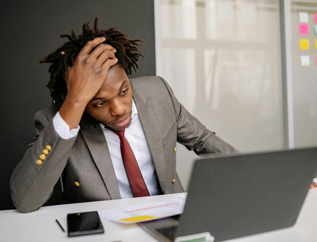 professional reviewing his portfolio and expressing frustrations