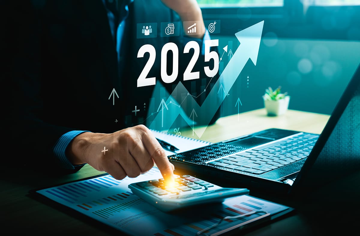 businessman typing on a computer with 2025 on the photo