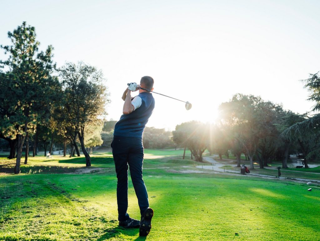 man golfing and enjoying his retirement