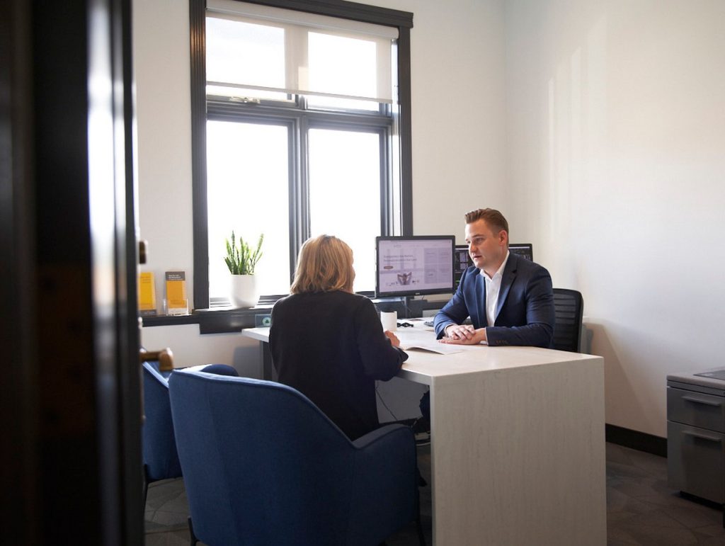 Ben sitting with a client
