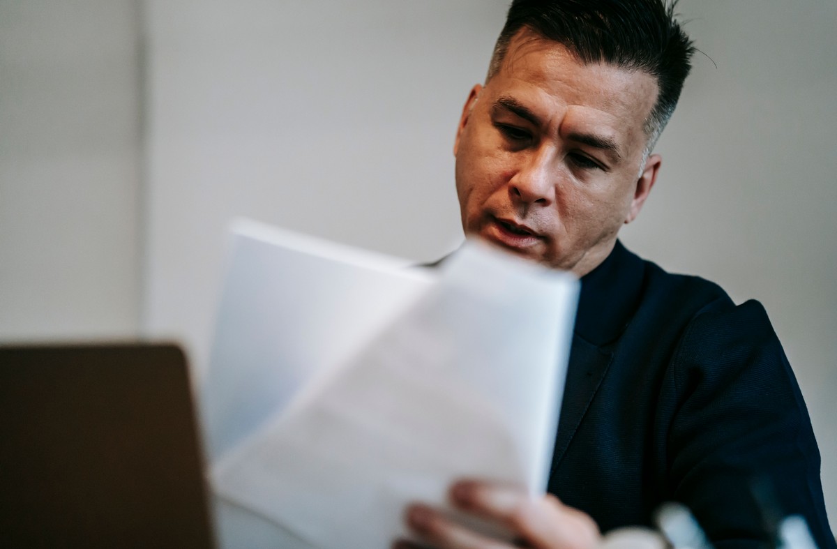 business owner reviewing his benefit plan costs after bill 11